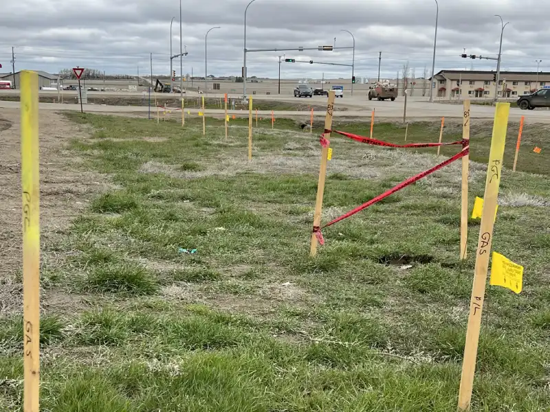 Line Location markings next to roadway Line Location markings next to roadway